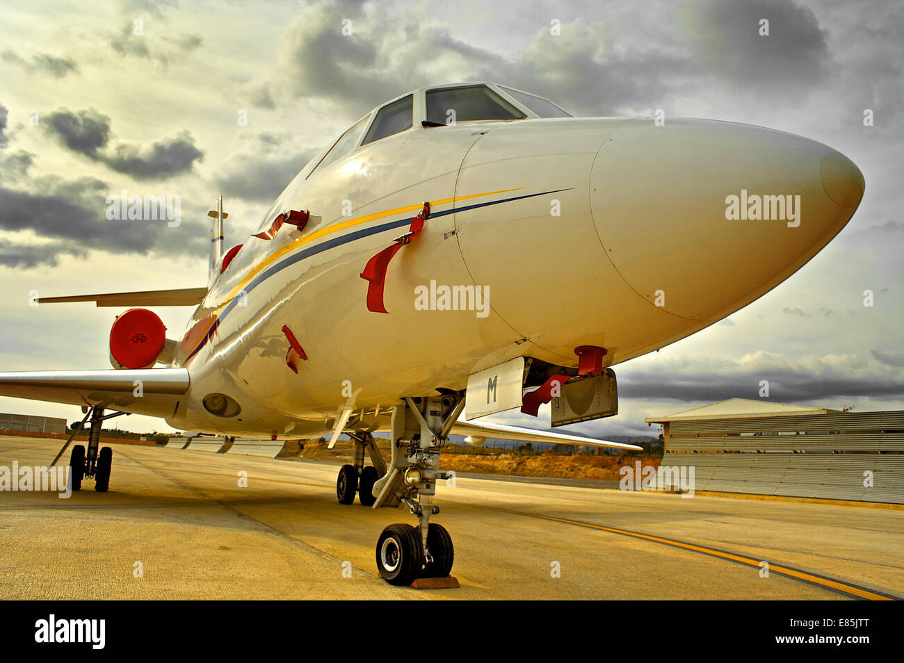 Private jet on runway with red ribbons Stock Photo Alamy