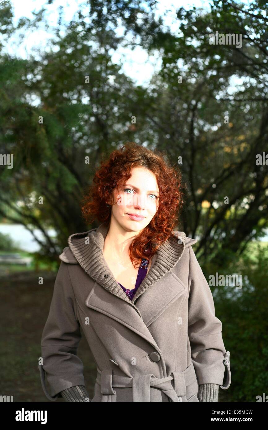 Portrait of a redheaded girl near a tree (autumn colors Stock Photo - Alamy