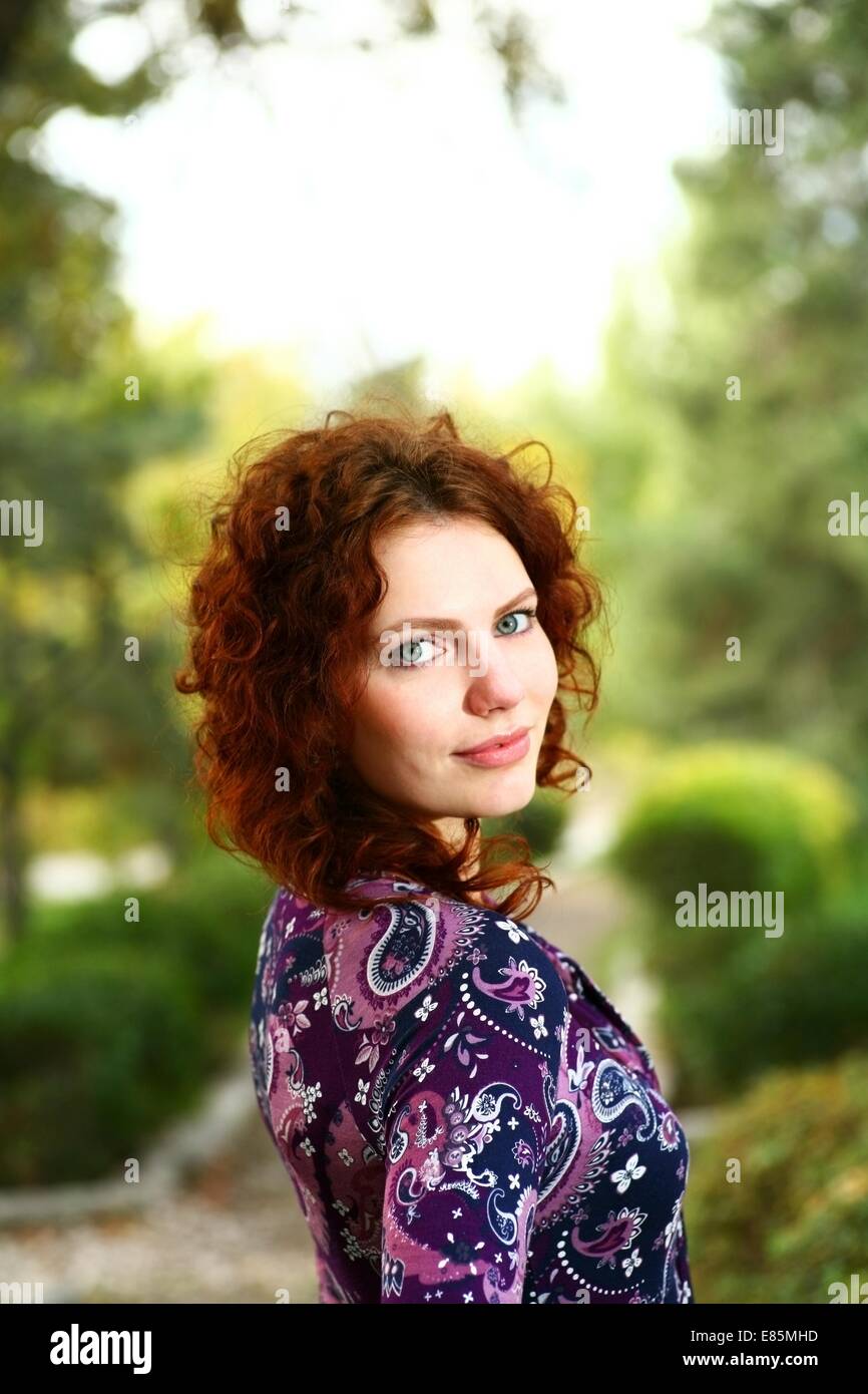 Portrait of a redheaded girl near a tree (autumn colors Stock Photo - Alamy