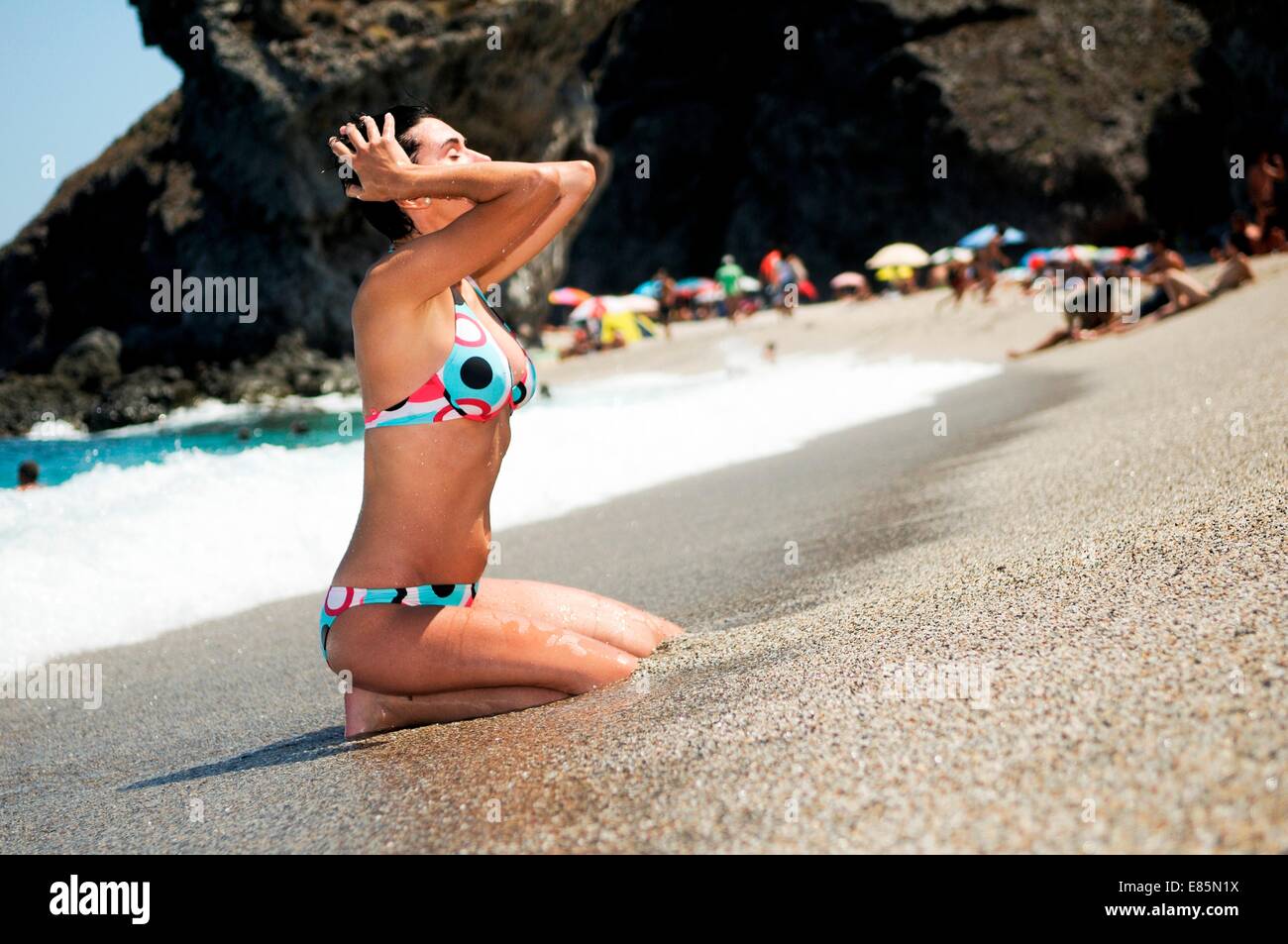 Woman on shore Stock Photo - Alamy