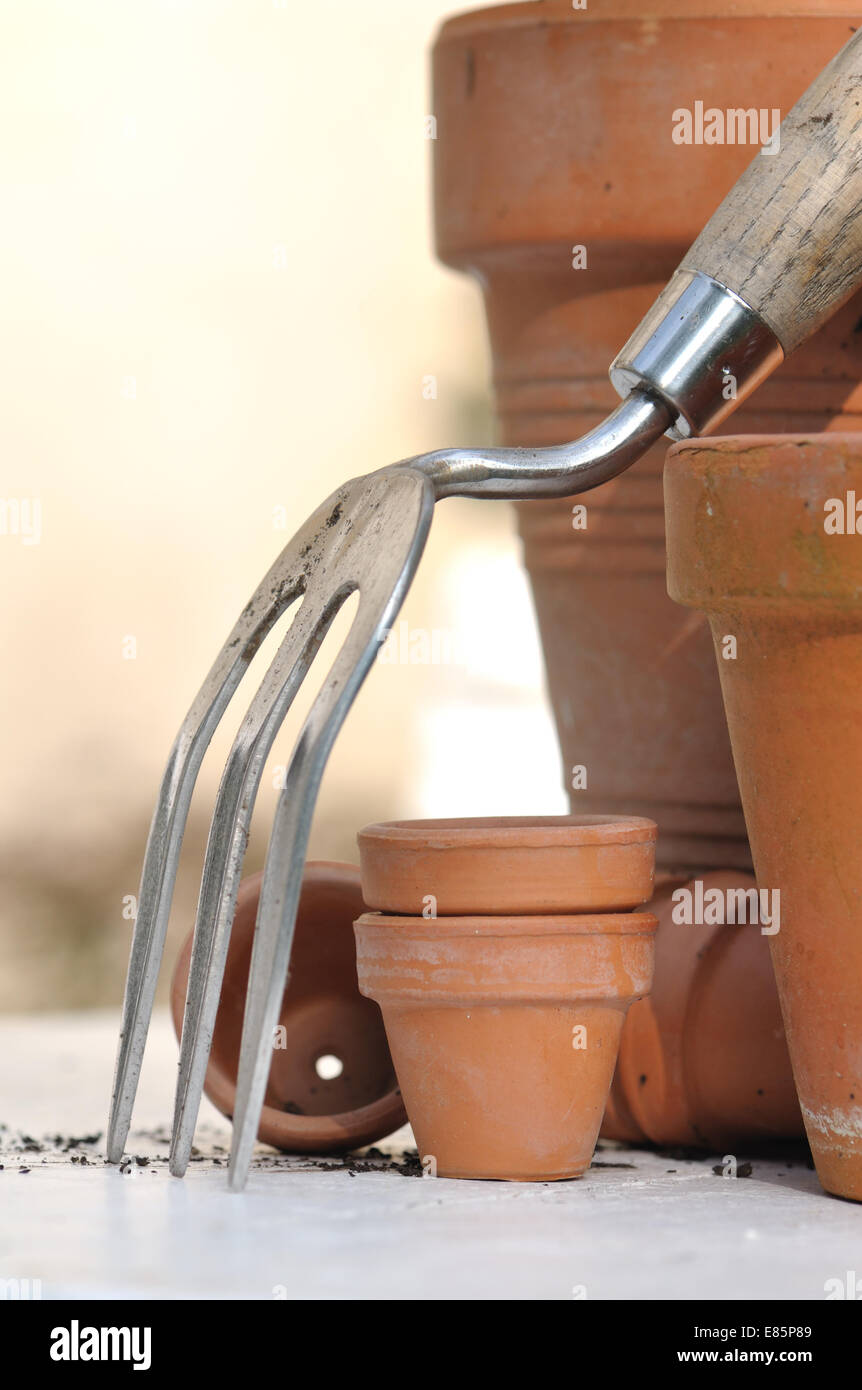 different sizes of terracotta pots with gardening tool Stock Photo