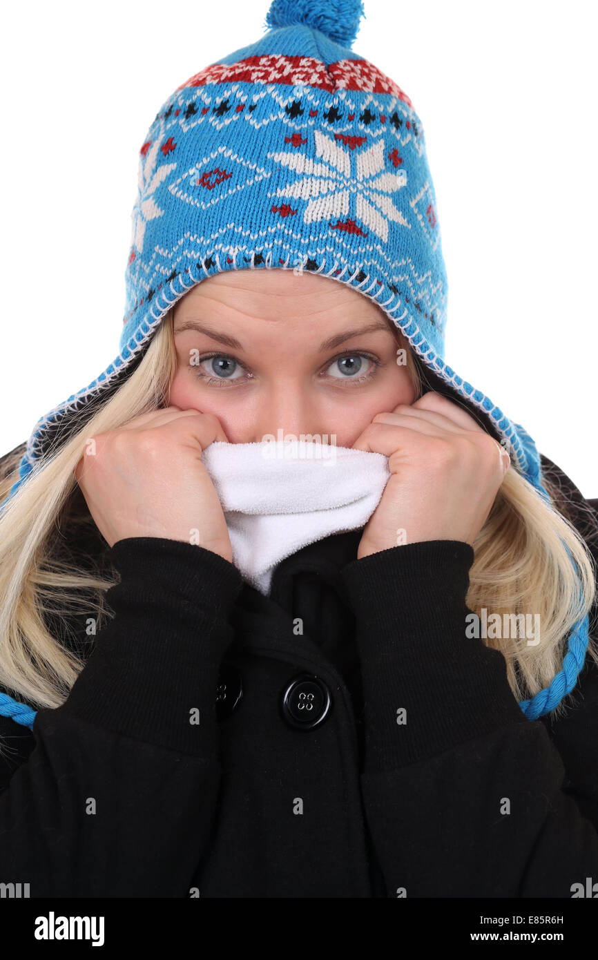 Young woman with a cap freezing in winter, isolated on a white background Stock Photo