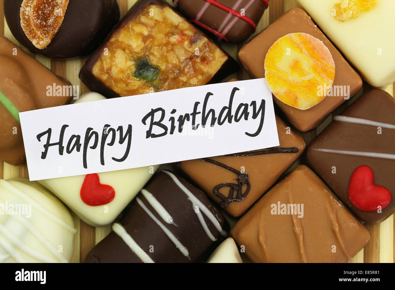 Happy birthday card with assorted chocolates Stock Photo - Alamy