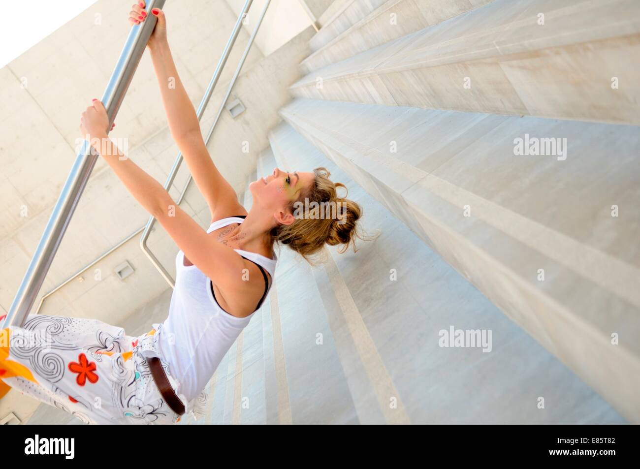 Woman hanging upside down from hi-res stock photography and images - Alamy