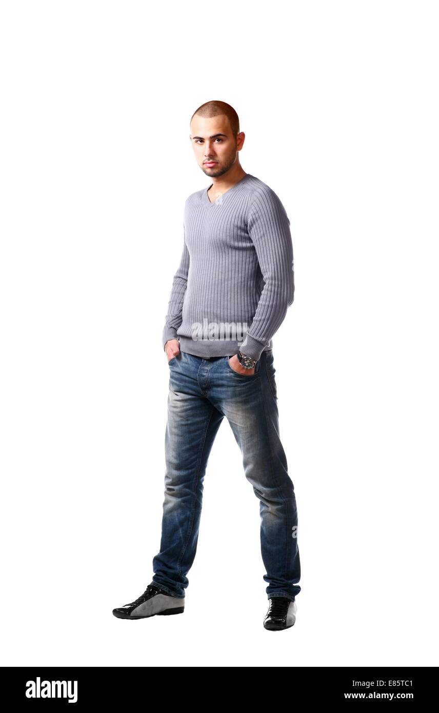 Casual friendly man in jeans and pullover - isolated over a white background Stock Photo