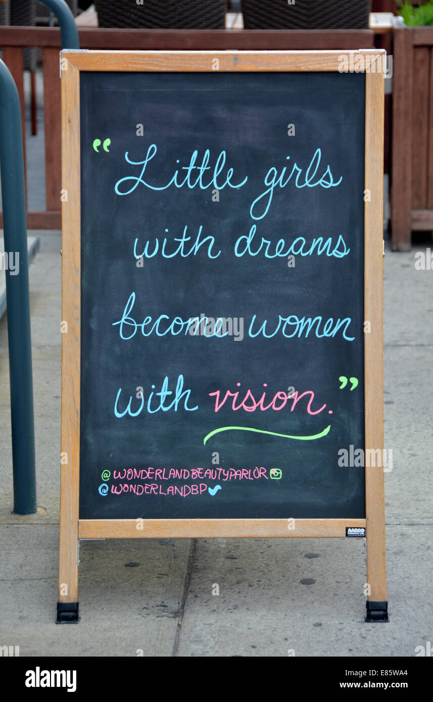 An unusual sign about women outside Wonderland Beauty Parlor on West 13th Street in Greenwich Village, Manhattan, New York City Stock Photo