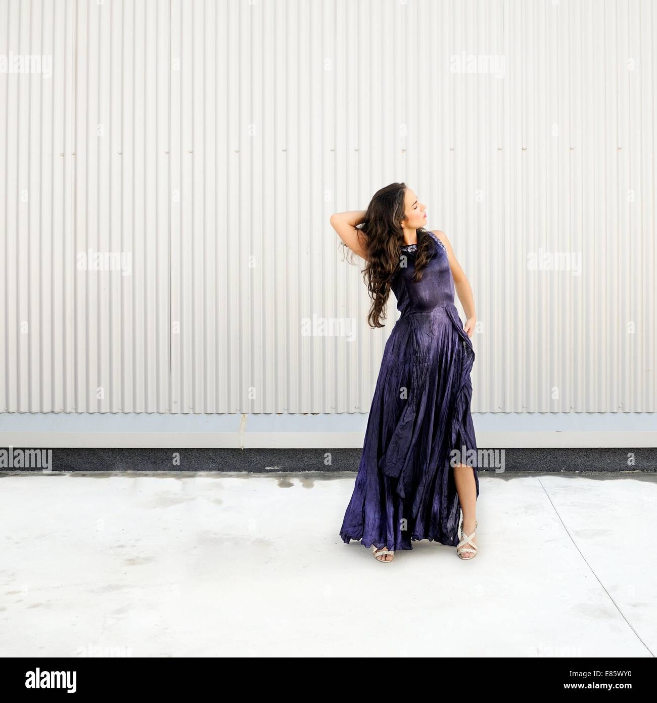 Woman in long purple dress Stock Photo - Alamy