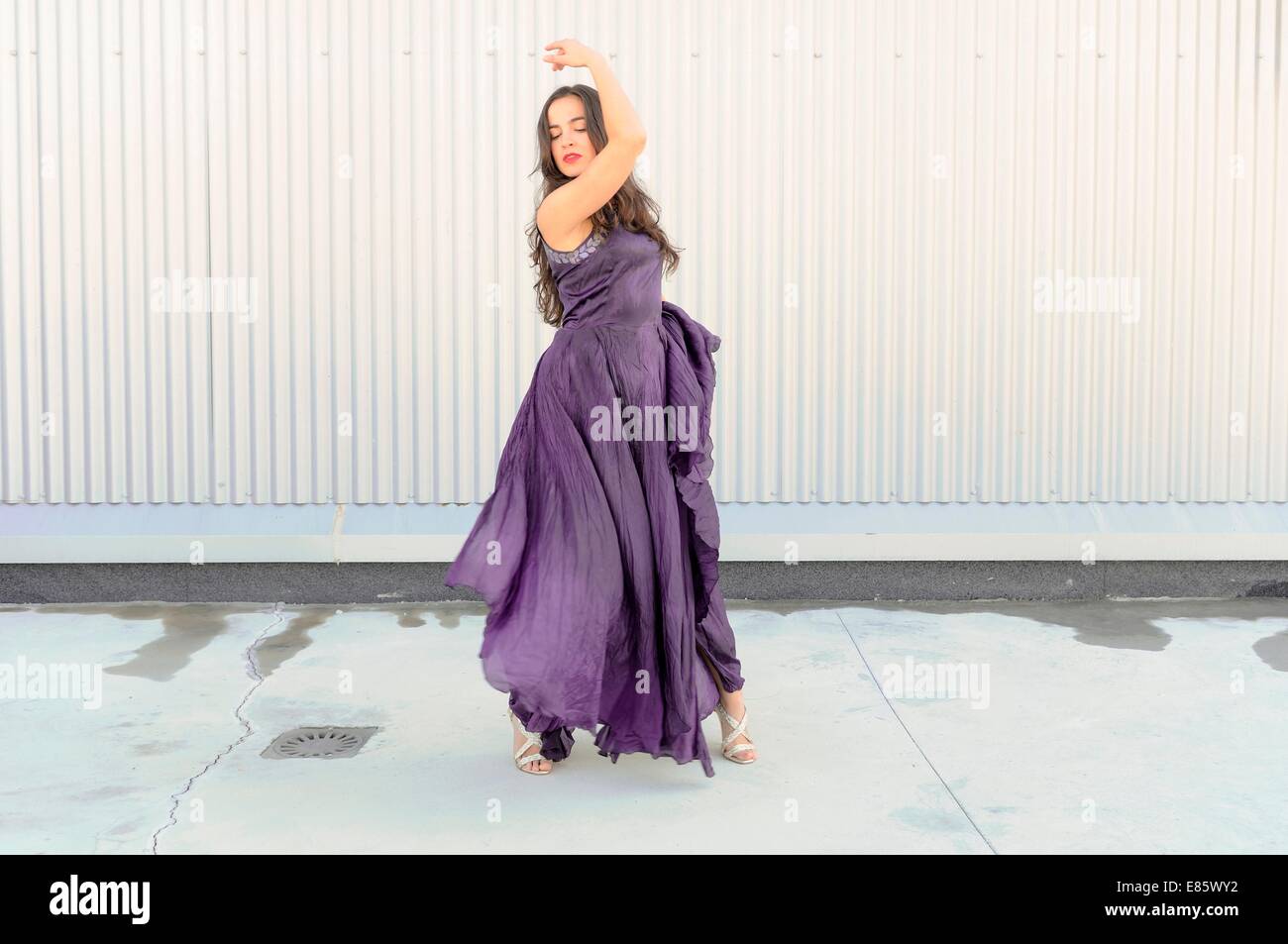 Woman in long purple dress Stock Photo - Alamy