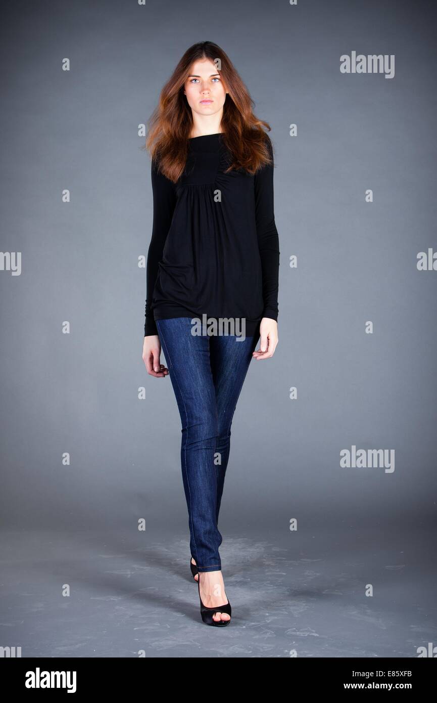 Portrait of the beautiful girl on a dark background Stock Photo - Alamy