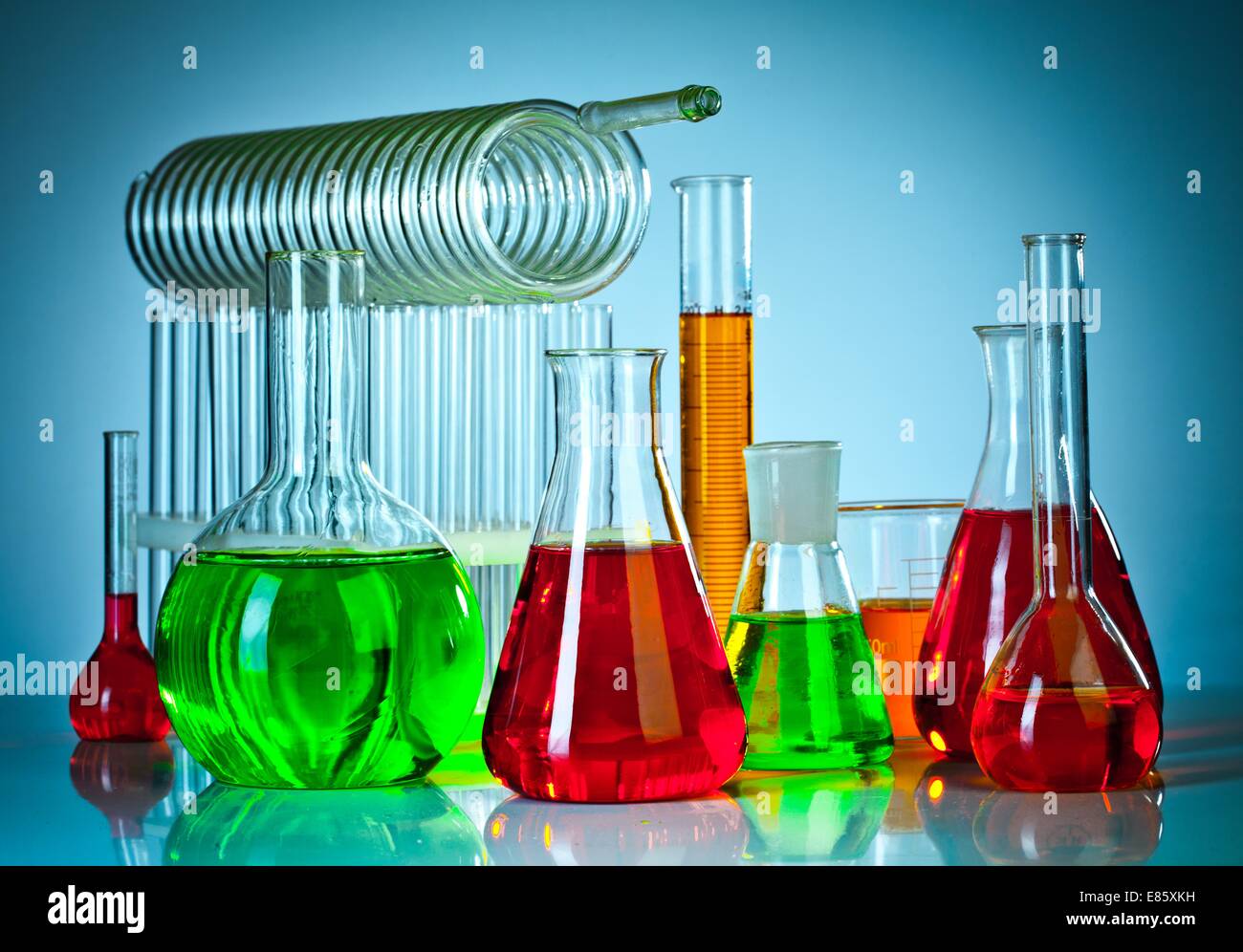 Test tubes on blue background Stock Photo - Alamy