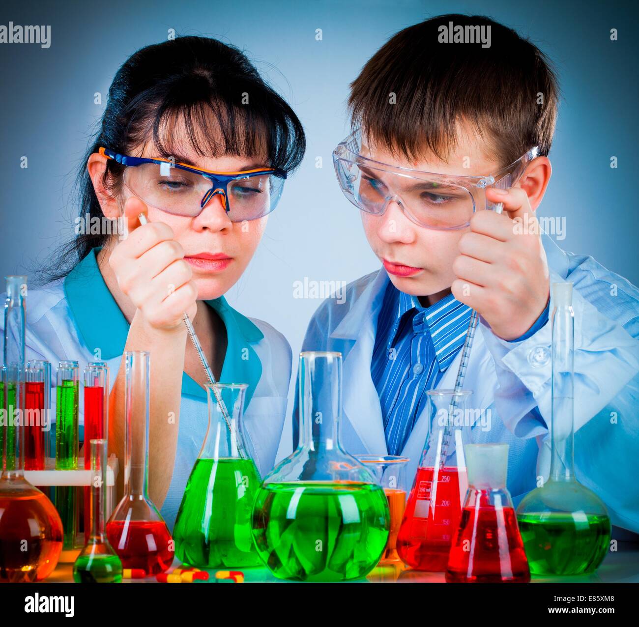 schoolteacher and student working in the lab Stock Photo - Alamy