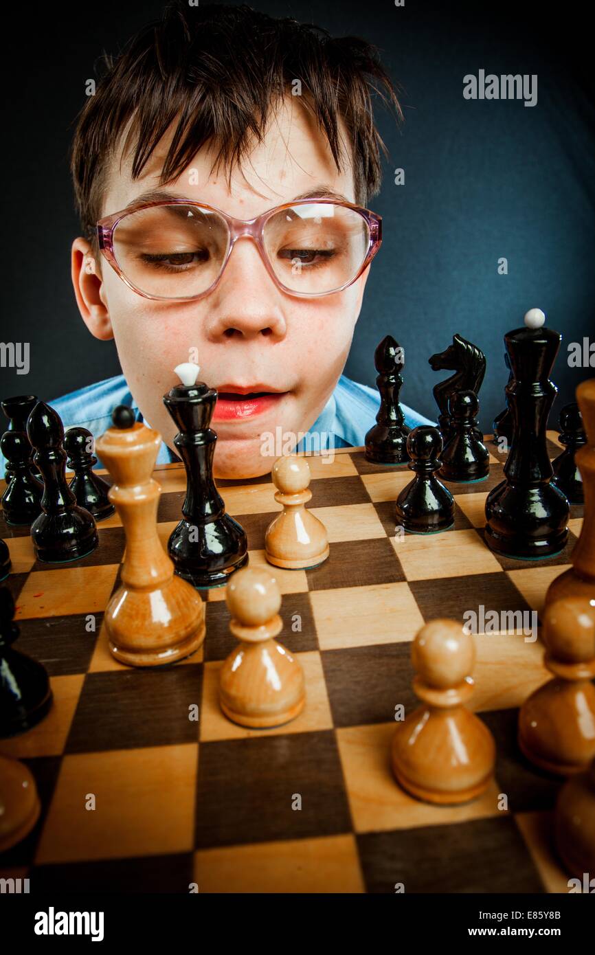 wunderkind play chess. Nerd boy. Stock Photo
