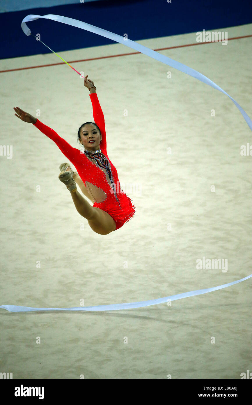 Incheon, South Korea. 1st Oct, 2014. Deng Senyue of China performs during the gymnastics rhythmic team final at the 17th Asian Games in Incheon, South Korea, Oct. 1, 2014. Uzbekistan won the gold medal and China ranked 5th. Credit:  Shen Bohan/Xinhua/Alamy Live News Stock Photo