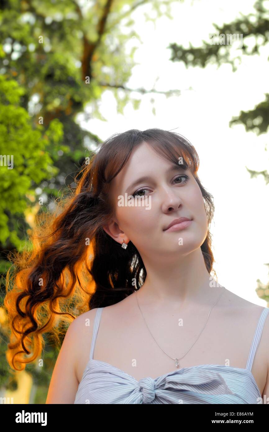 Young girl smiling, portrait in nature Stock Photo - Alamy