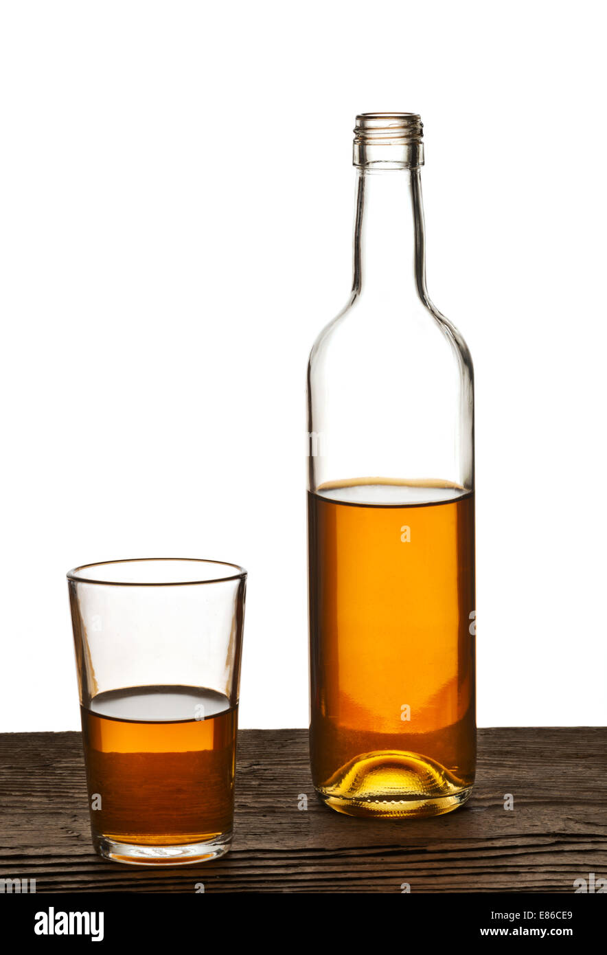 glass and bottle of brandy isolated on the white background Stock Photo