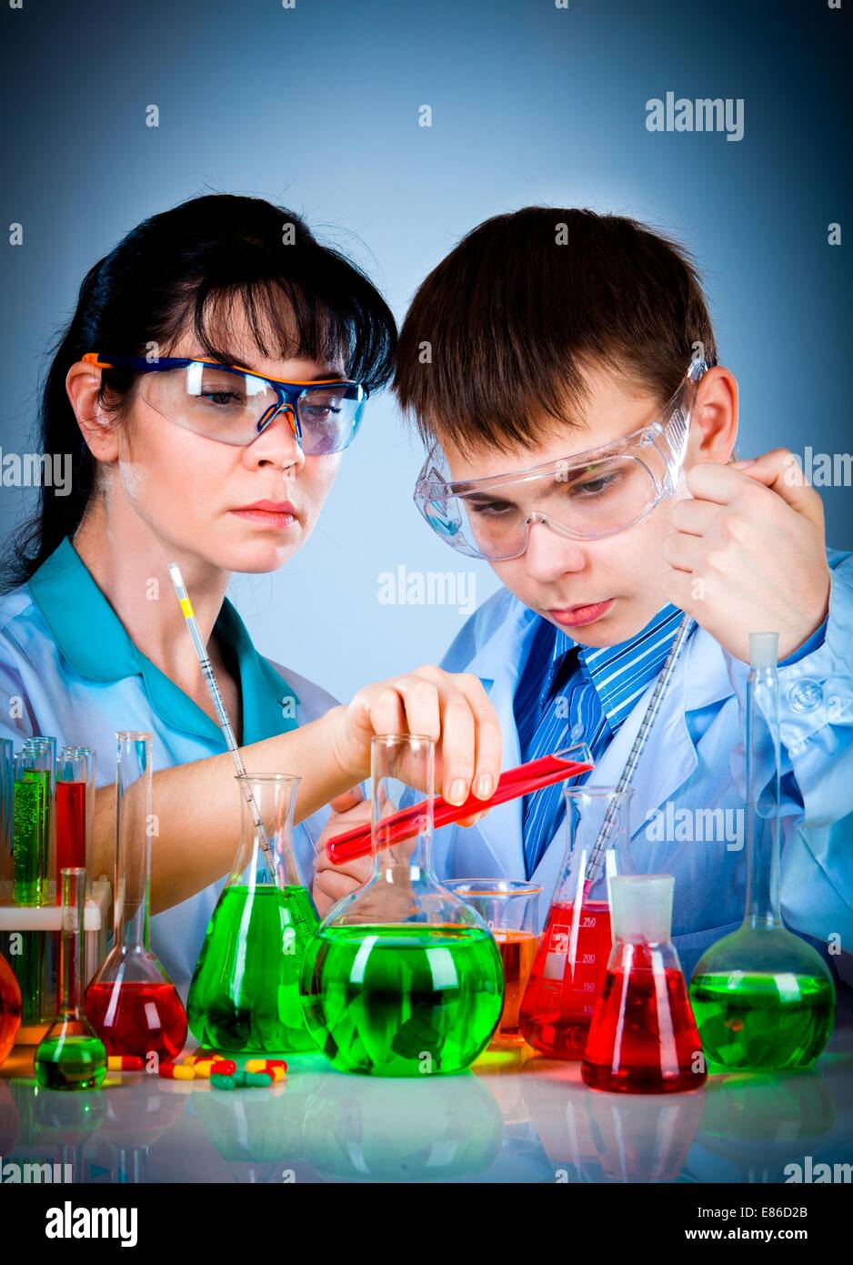 schoolteacher and student working in the lab Stock Photo - Alamy