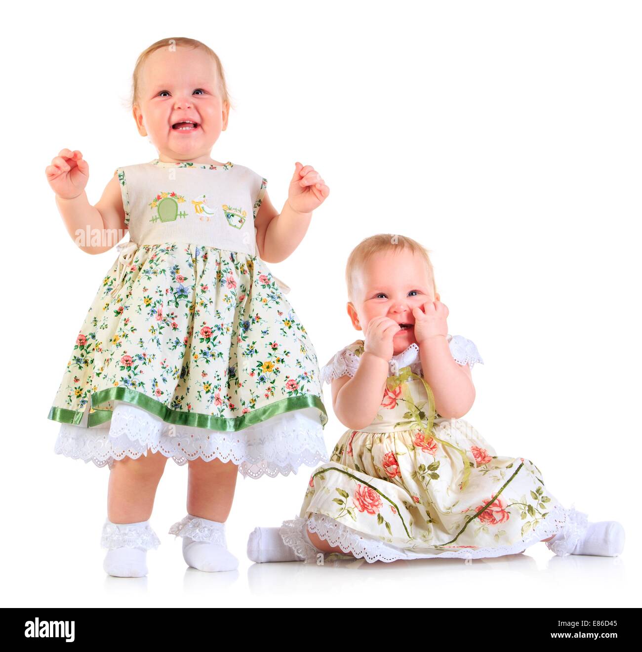 one years old baby girls on a white background Stock Photo Alamy