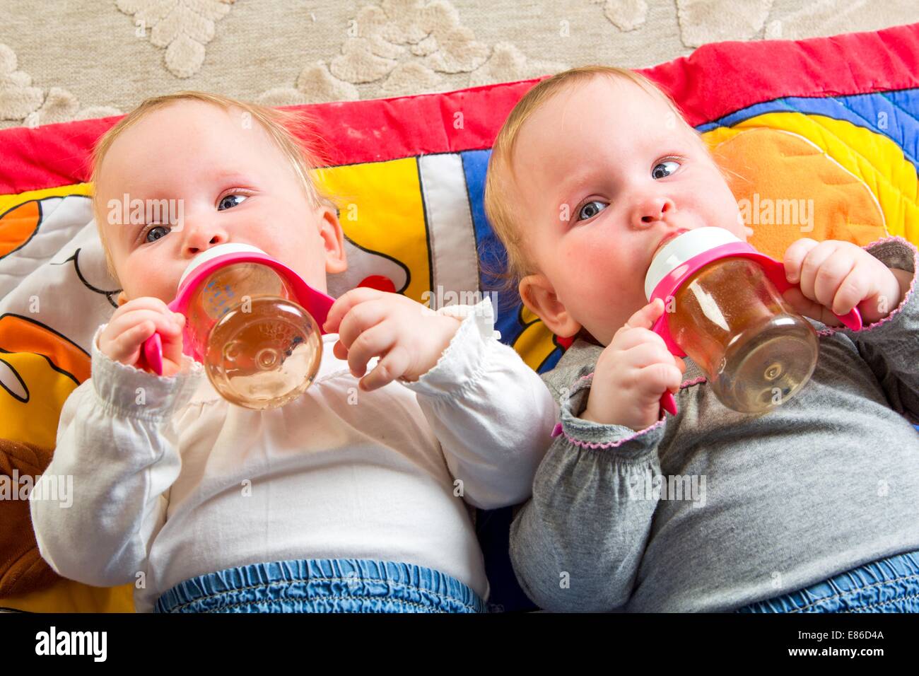 one years old baby eating from bottle Stock Photo - Alamy