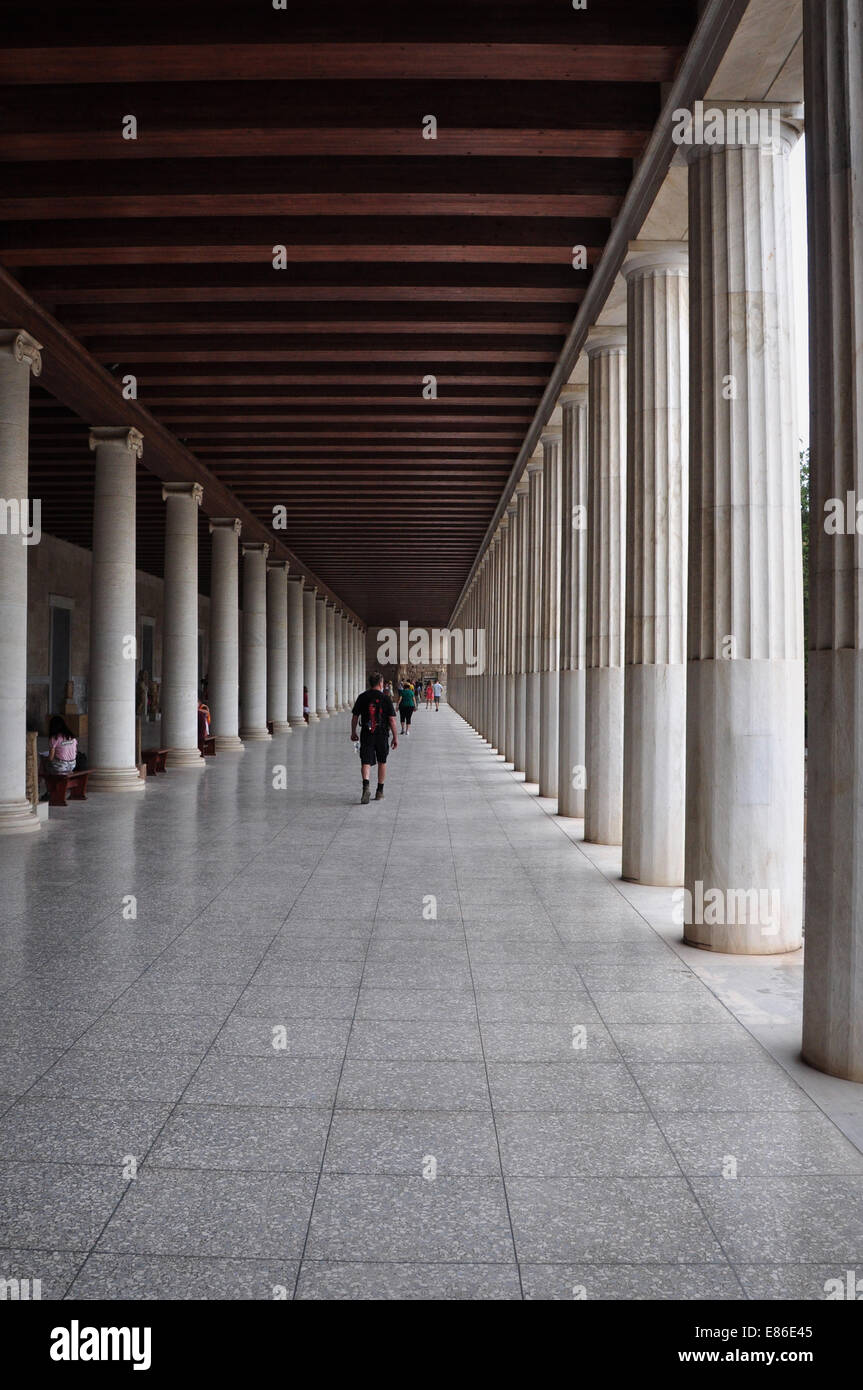 People visiting stoa of attalos covered walkway with ionic and doric columns in the ancient agora. Stock Photo