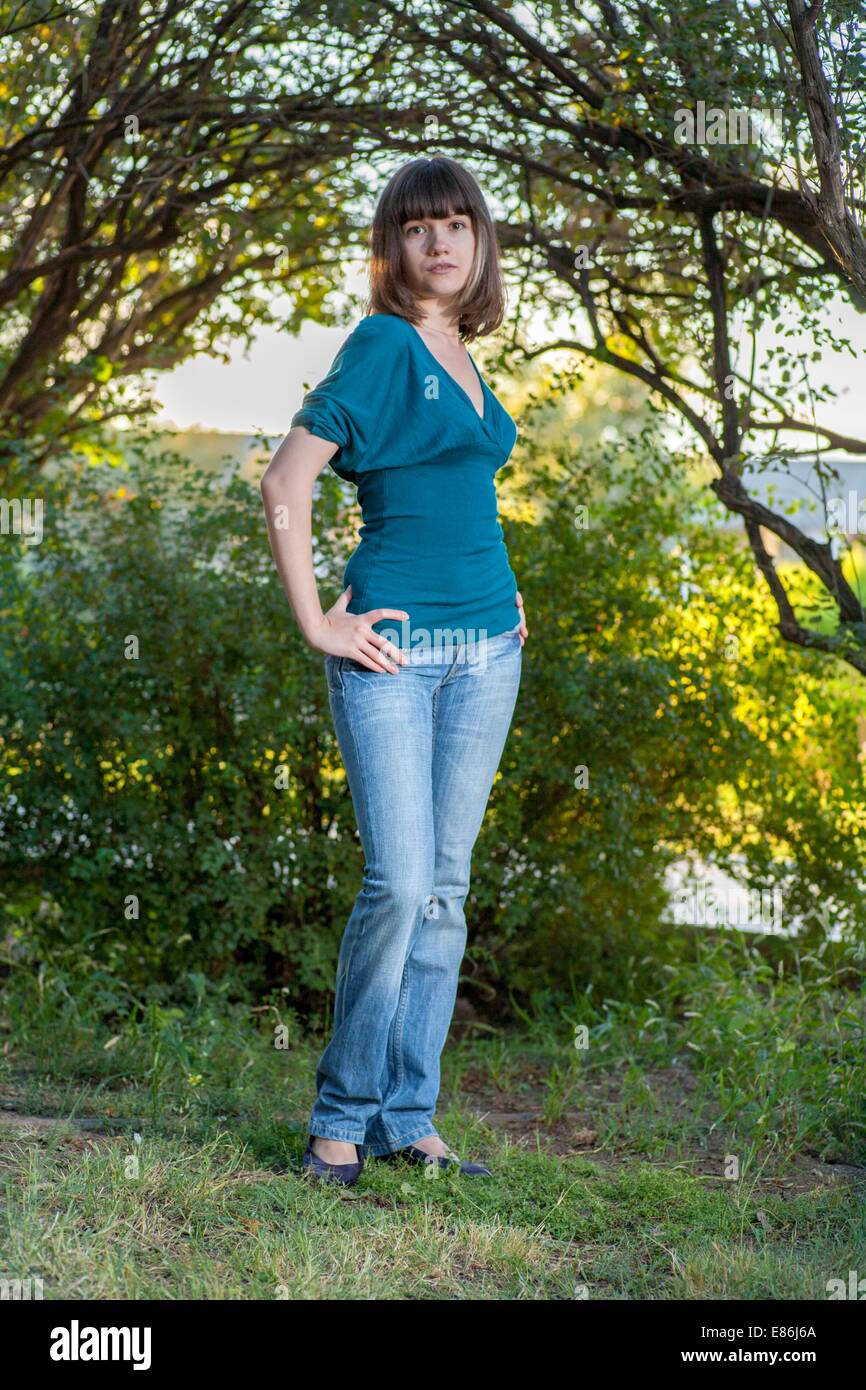 young brunette girl in green Stock Photo - Alamy