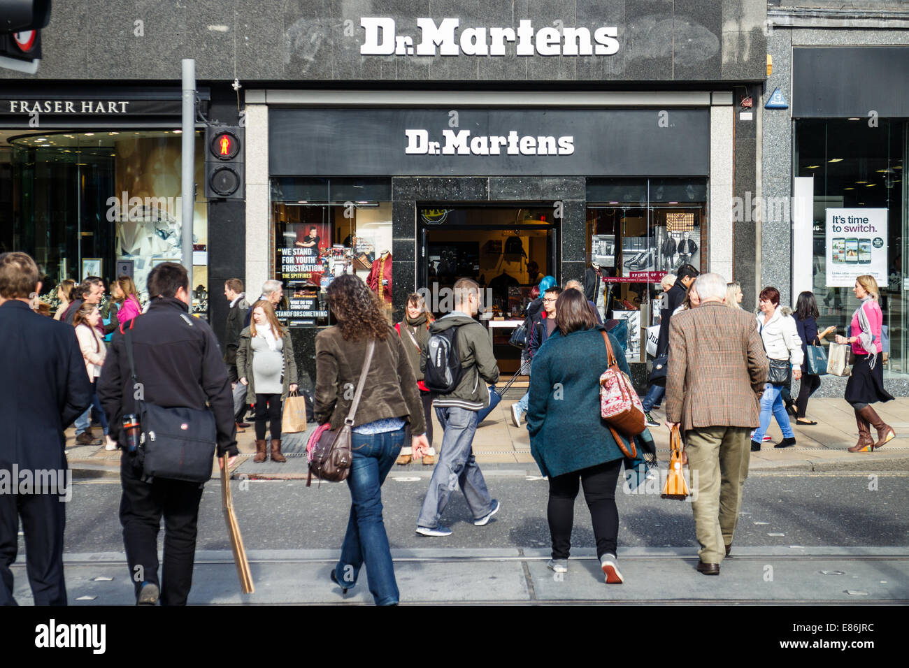 Shoppers crossing Princes Street in front of the Dr Martens store, Edinburgh,  Scotland Stock Photo - Alamy