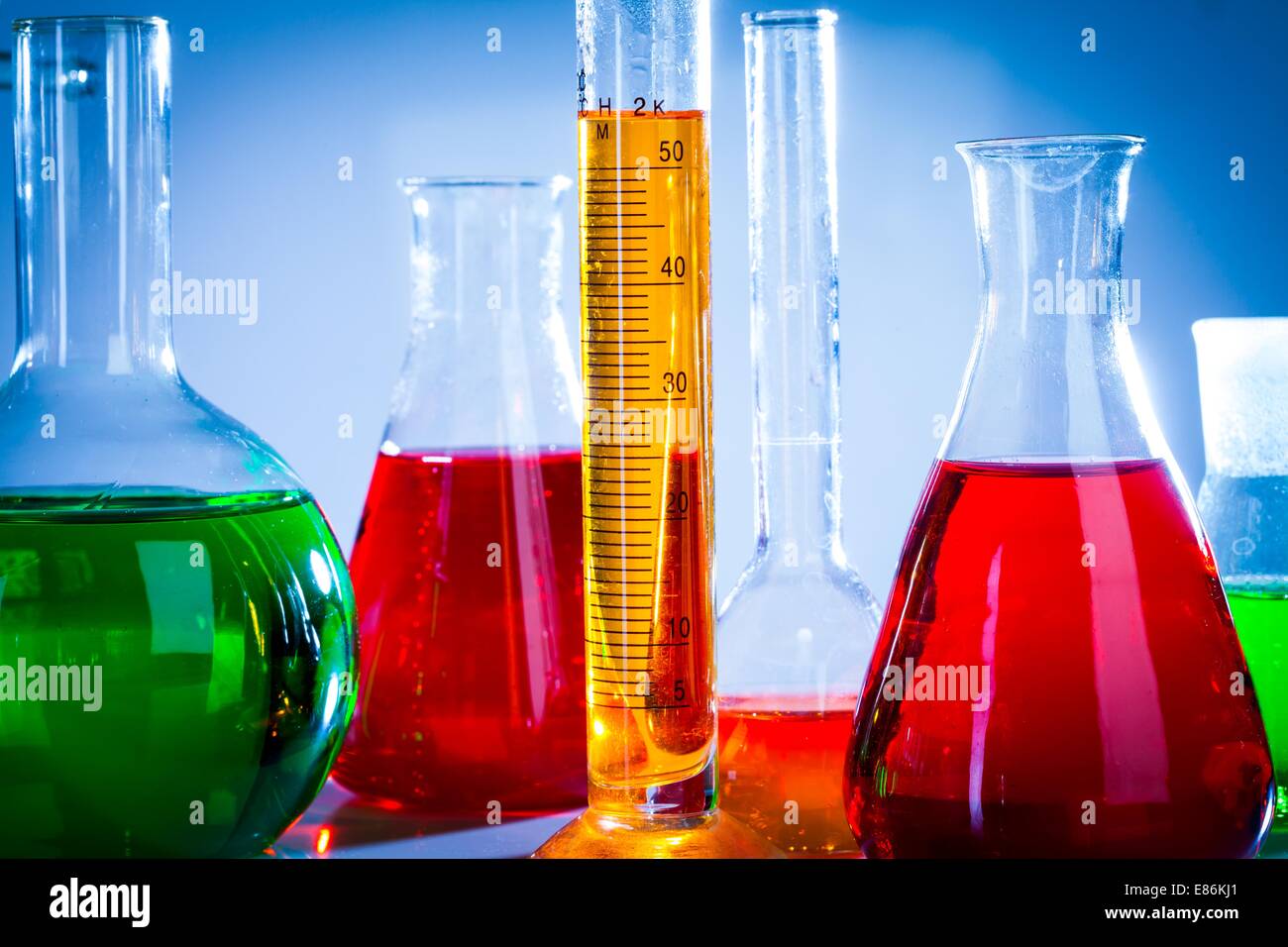 Glass test tubes in the laboratory on a blue background Stock Photo - Alamy