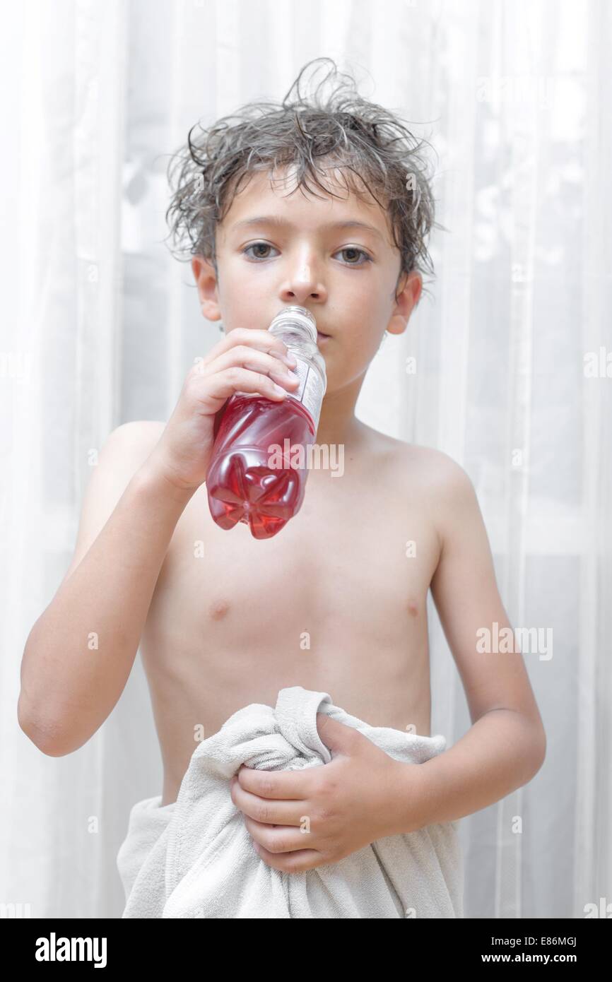 kid holding plastic bottle Stock Photo - Alamy
