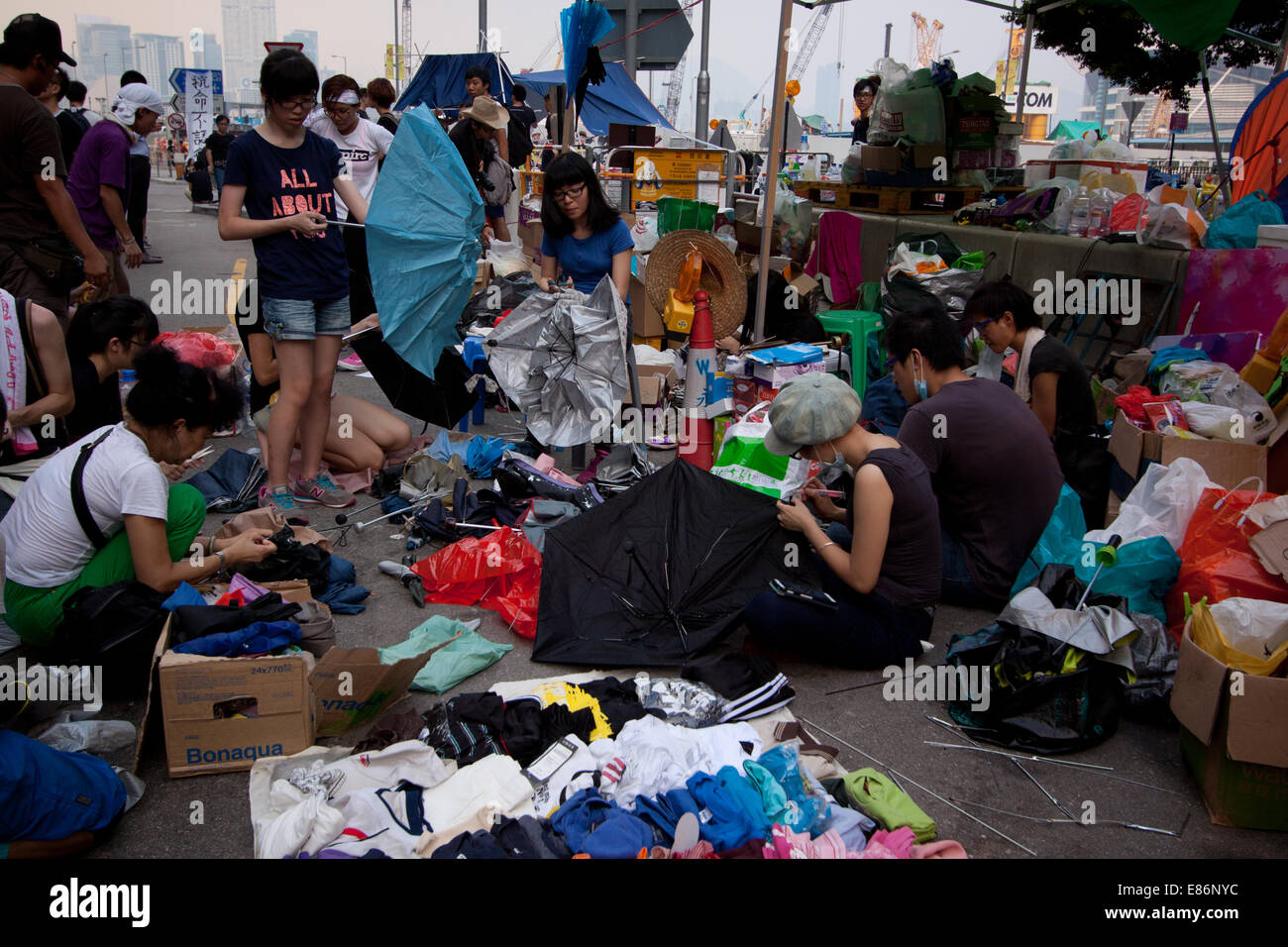 Hong Kong. 30th September, 2014. Umbrellas being repaired.  Protests against decision by Beijing to offer Hong Kong voters, choice of candidates for Chief Executive in 2017 elections from approved list of candidates, rather than an open list. Credit:  SCWLee/Alamy Live News Stock Photo