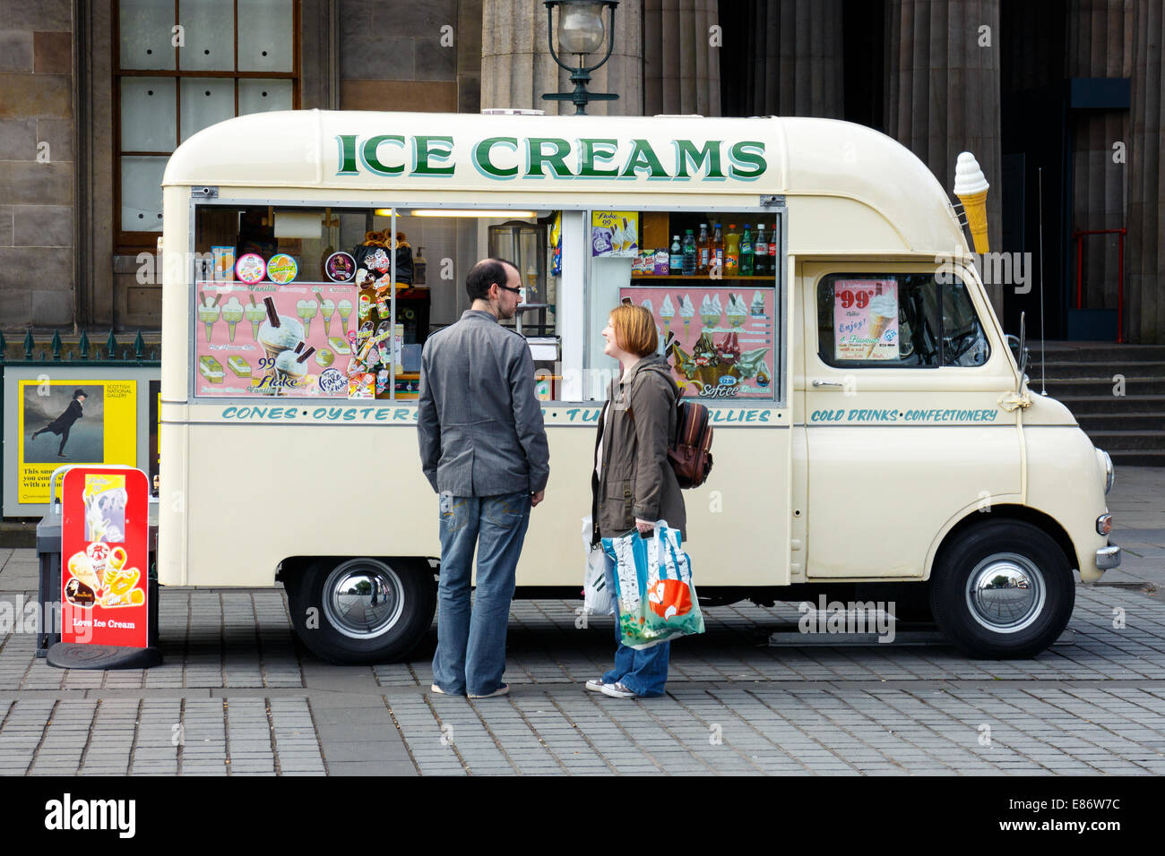 Tow people next to a vintage Bedford Ice Cream van. The Mound