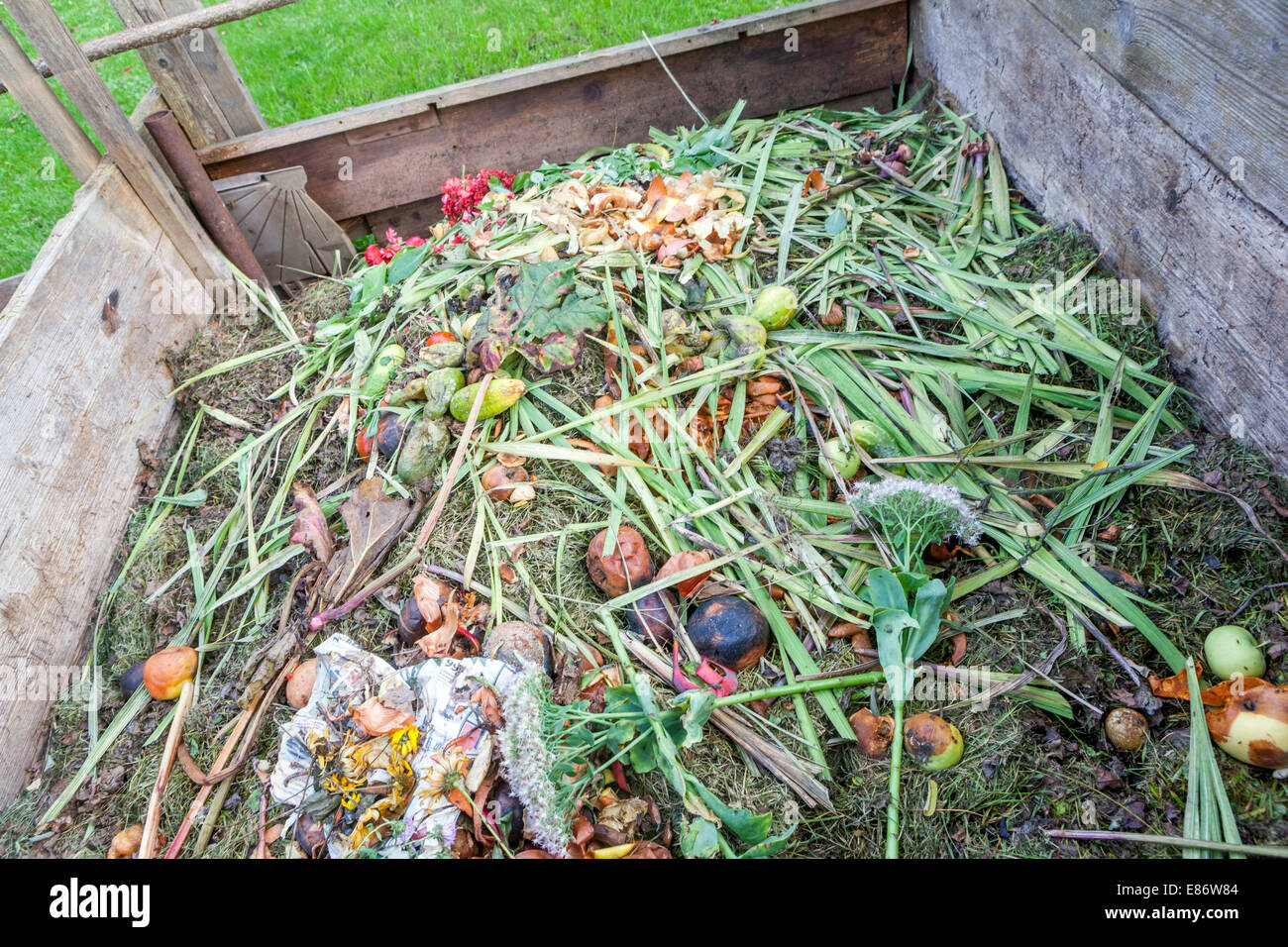 Garden compost heap in wooden composter, composting waste Stock Photo