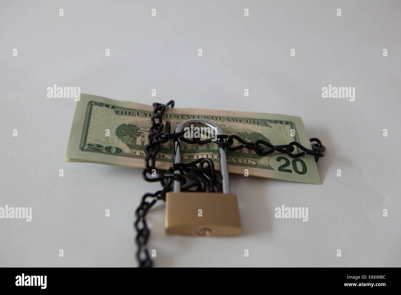 dollars tied up in a lock Stock Photo