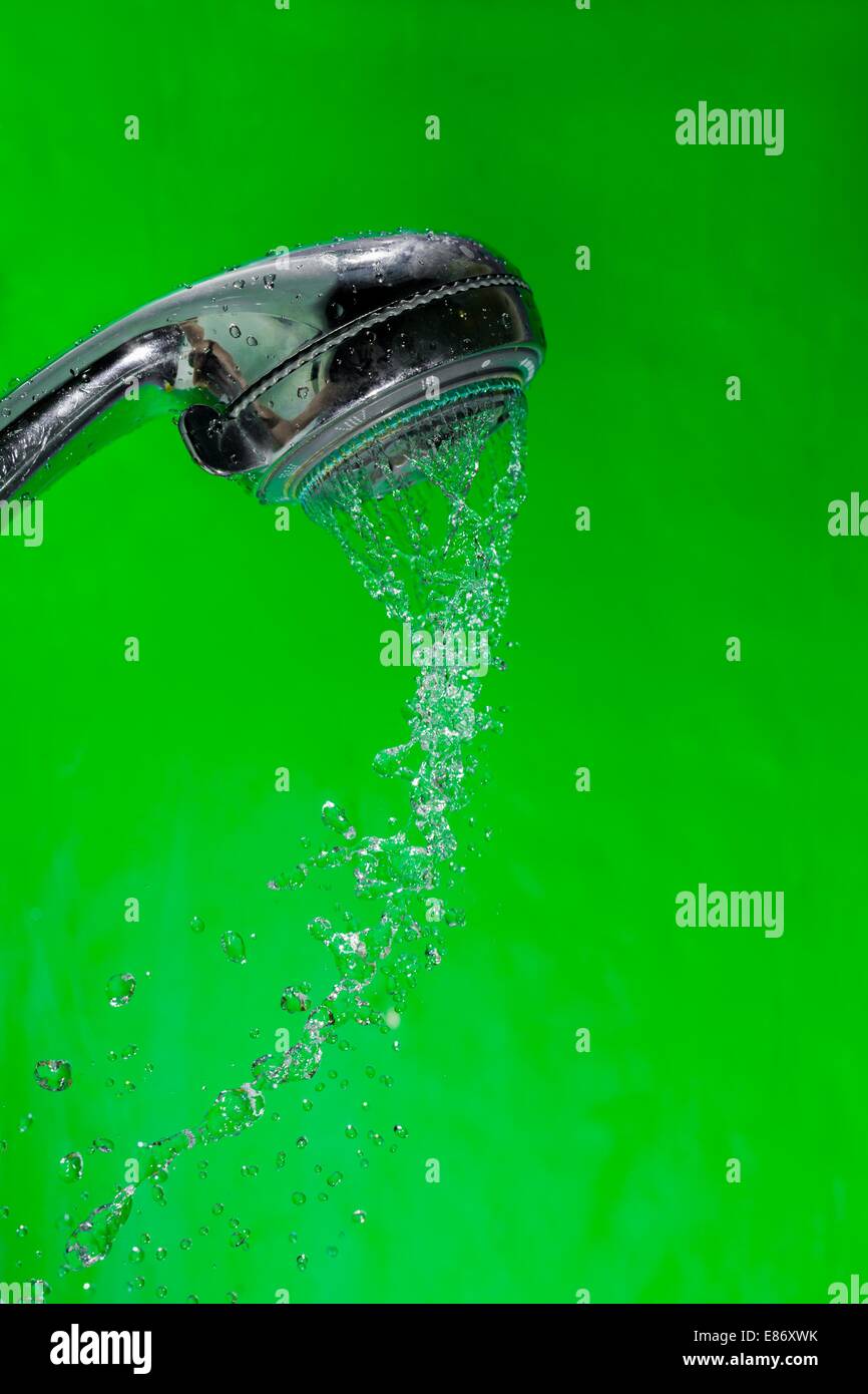 Shower with falling drops of water on the green background Stock Photo ...
