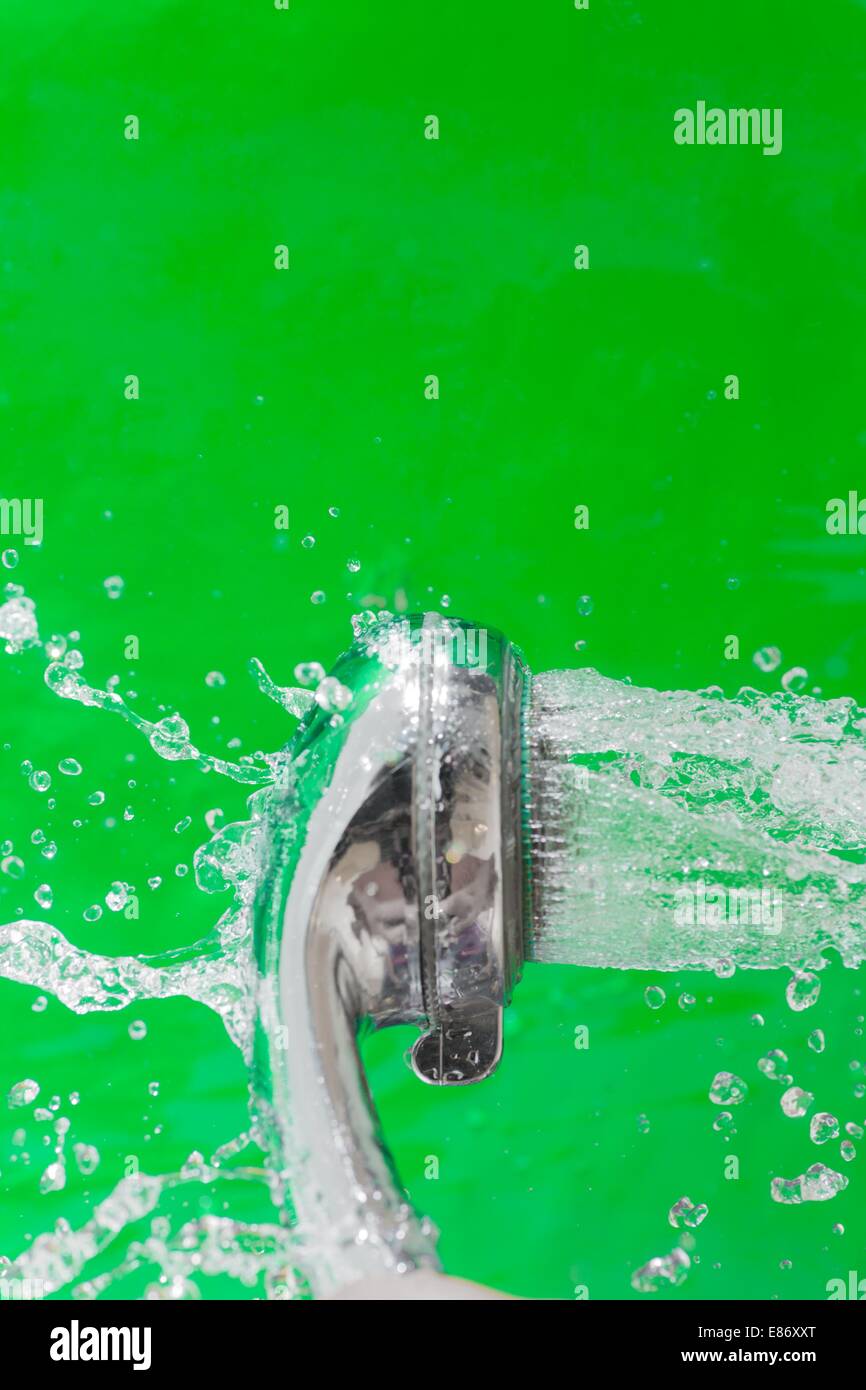 Shower with falling drops of water on the green background Stock Photo ...