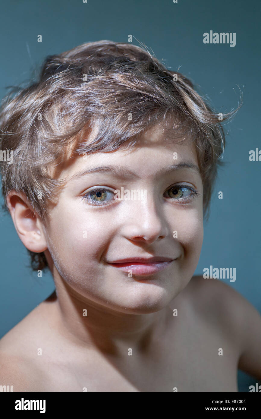 smile - 7 years old boy make funny faces Stock Photo