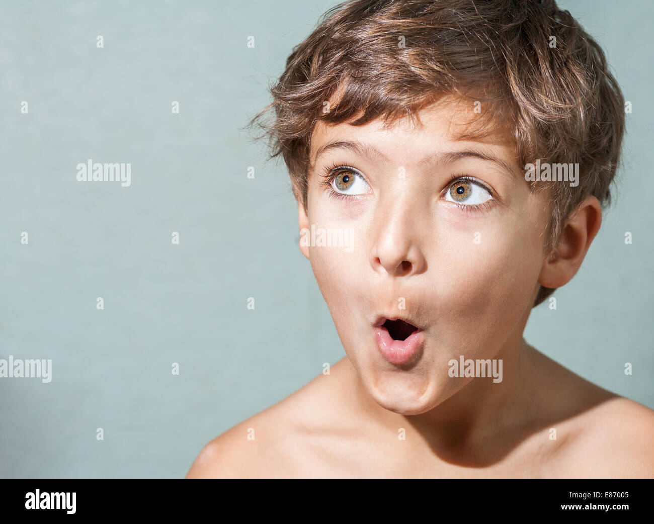 amazed 7 years old boy make funny faces Stock Photo