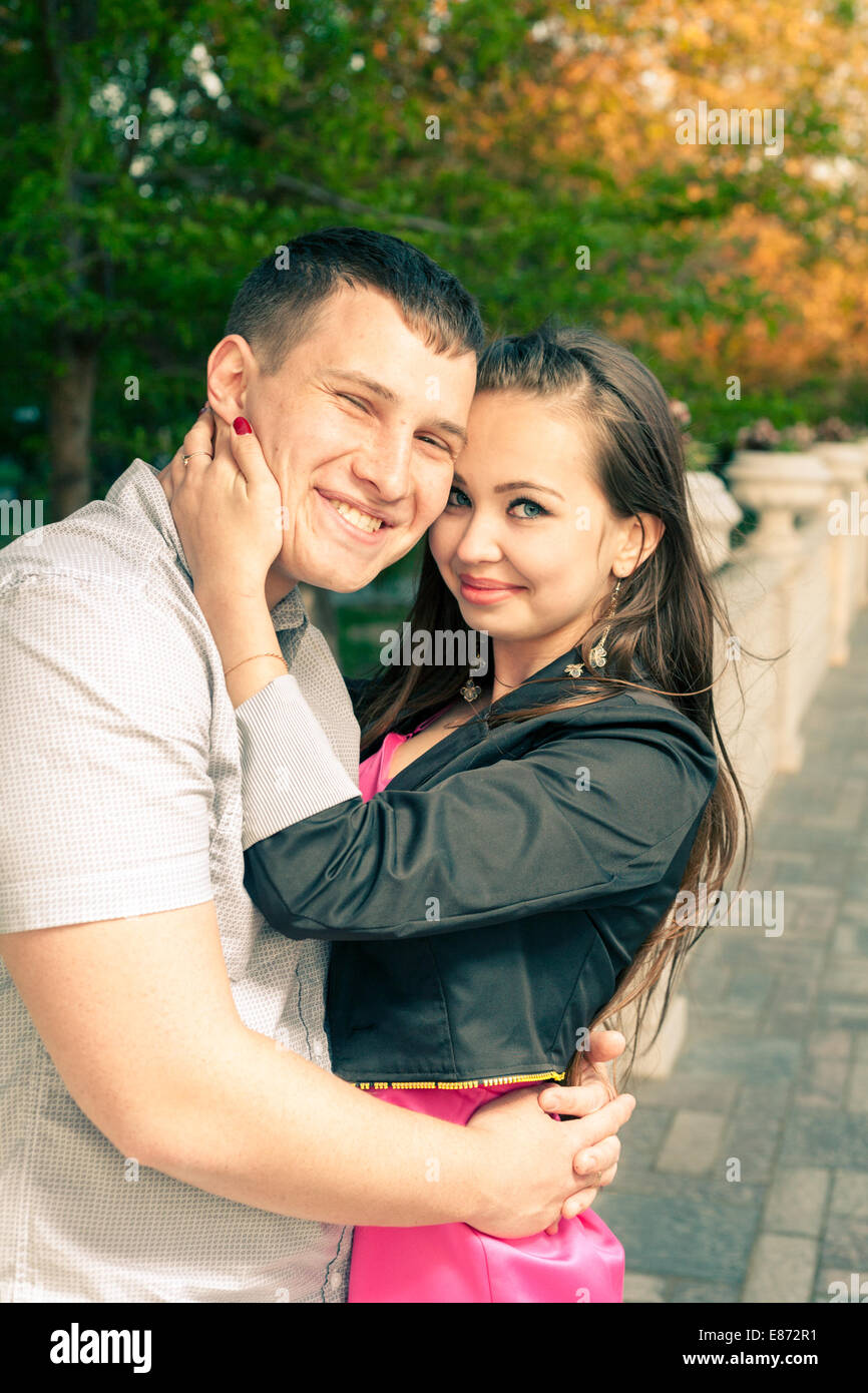 Happy couple embracing vertical colorized image Stock Photo