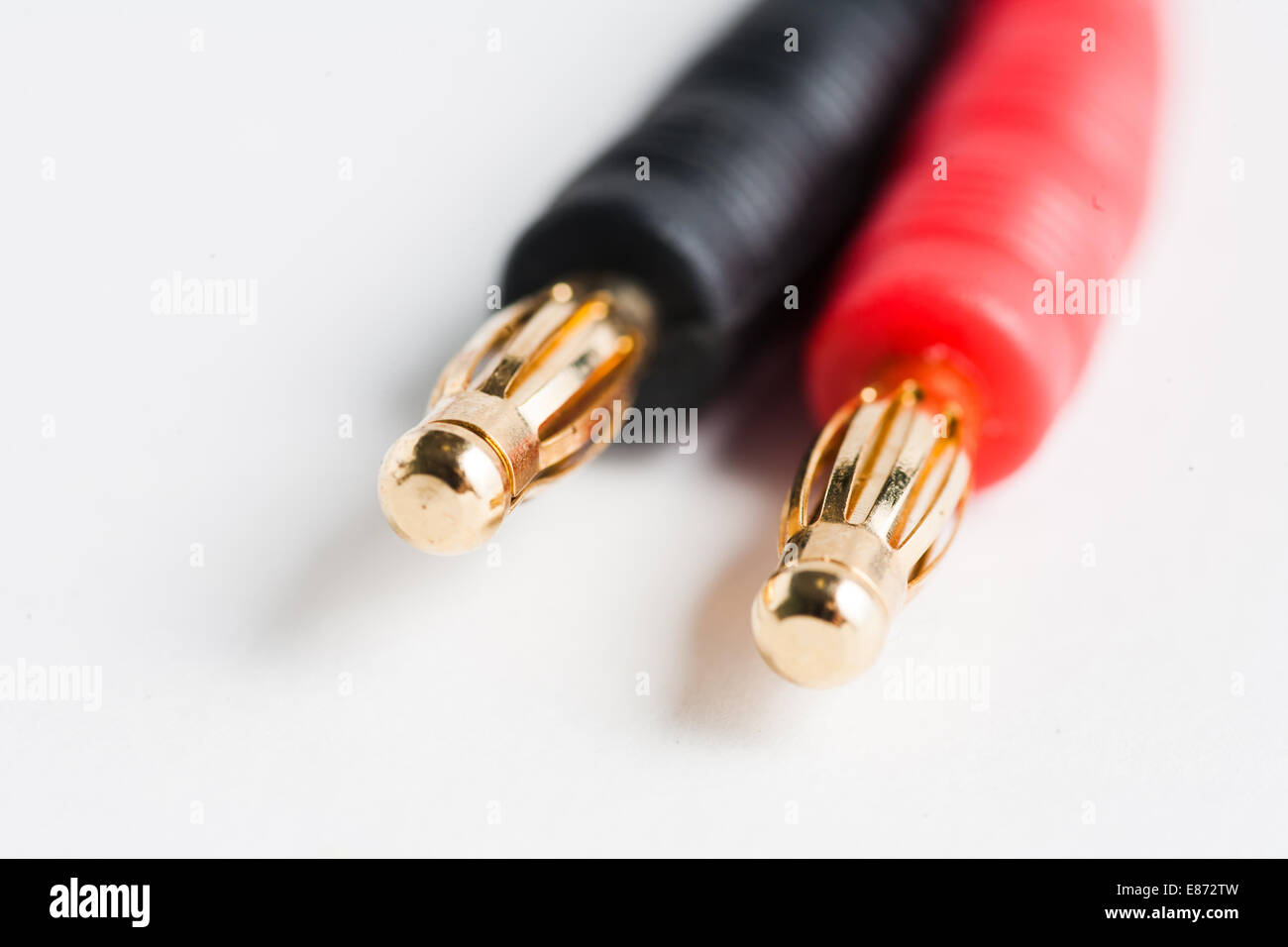 Couple of golden electric plug jacks of red and black color Stock Photo