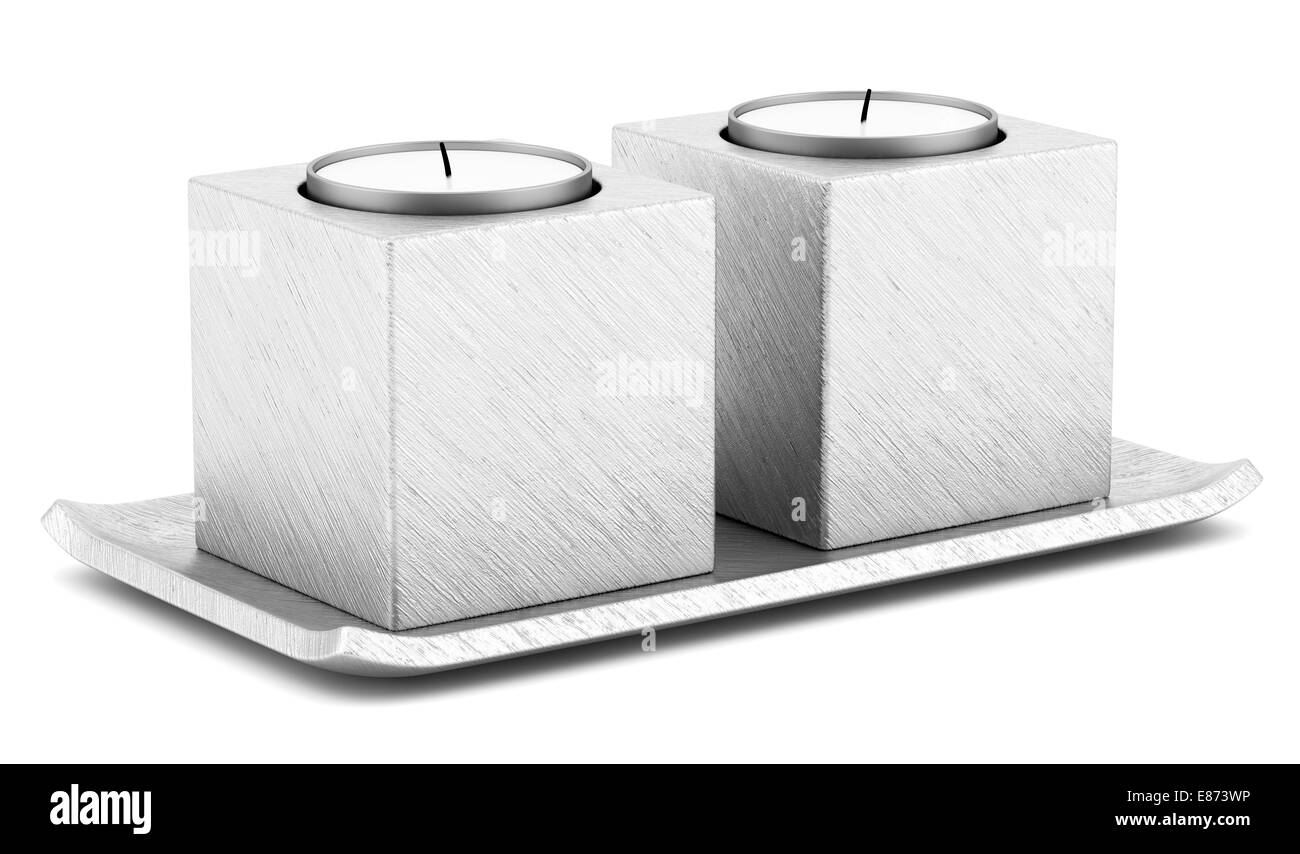 two metallic candlesticks with candles isolated on white background ...