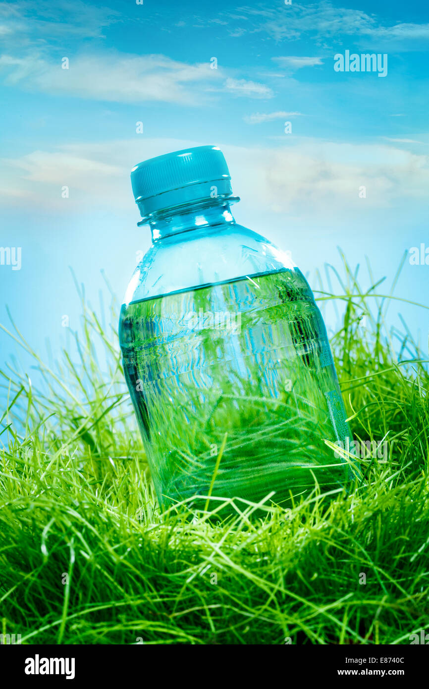 Bottle of water on the green grass Stock Photo - Alamy