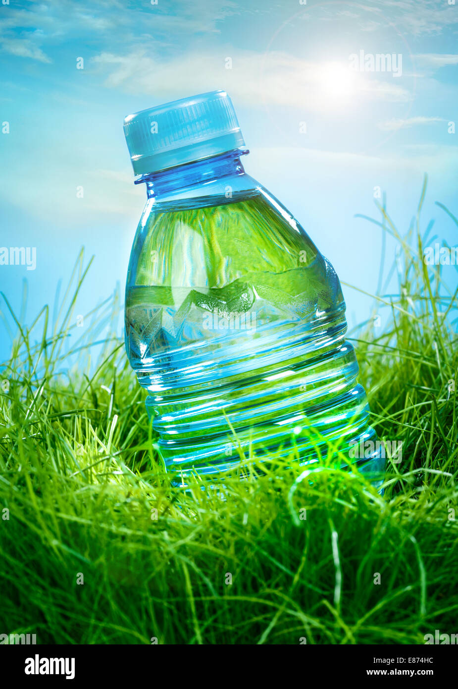Bottle of water on the green grass Stock Photo - Alamy