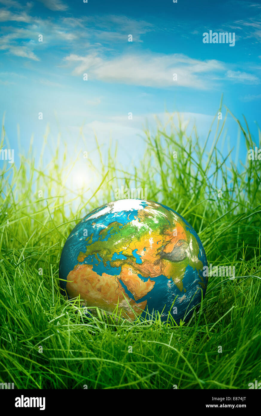 Globe lies on green grass. Concept - Earth Day Stock Photo - Alamy