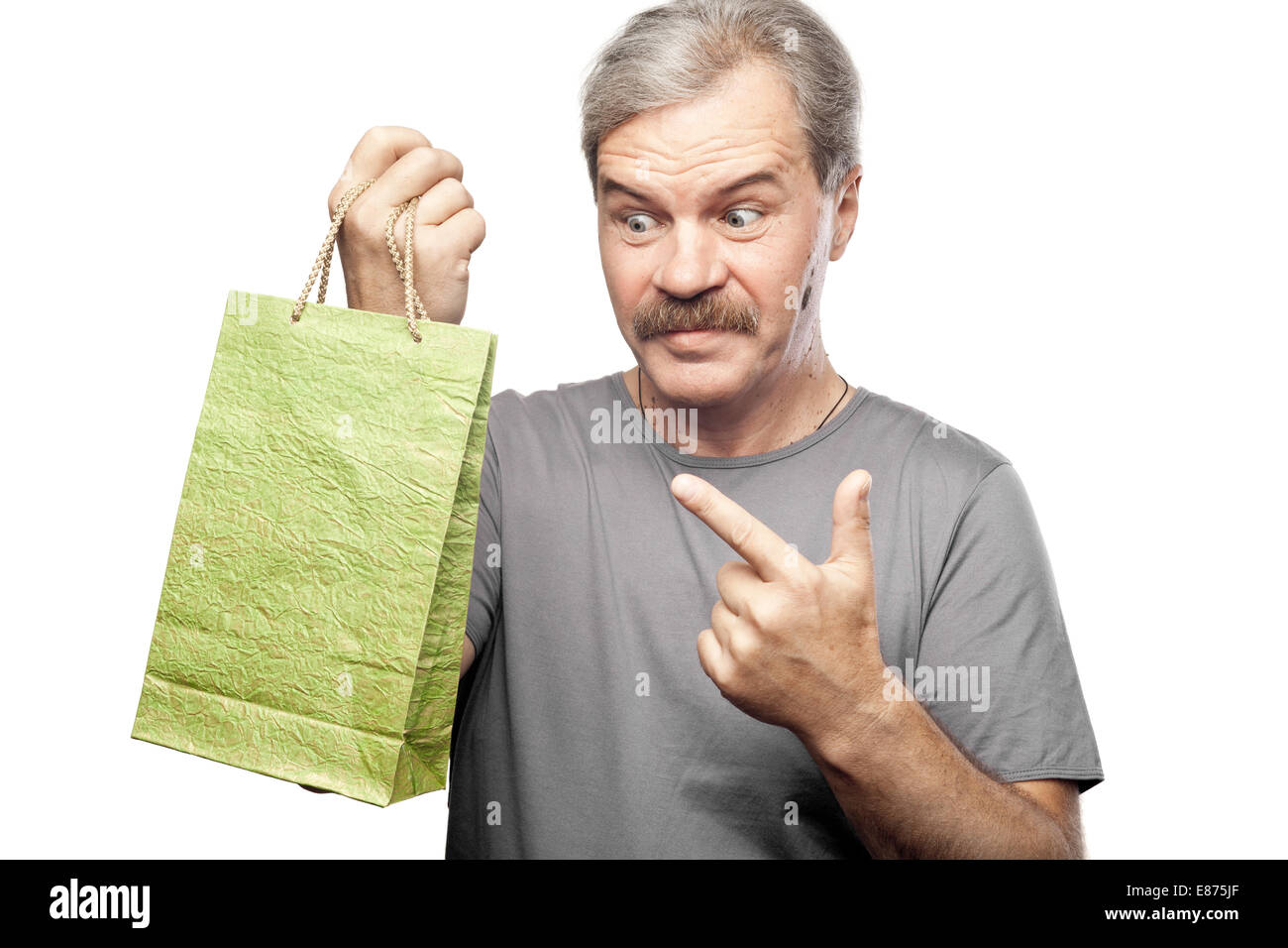 surprised mature man holding shopping bag isolated on white background Stock Photo