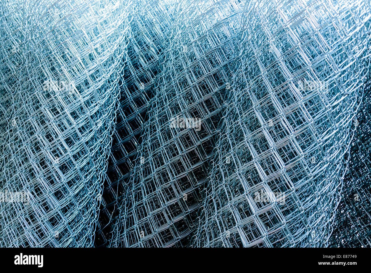 rolled supplies of shiny new chain link fence Stock Photo Alamy