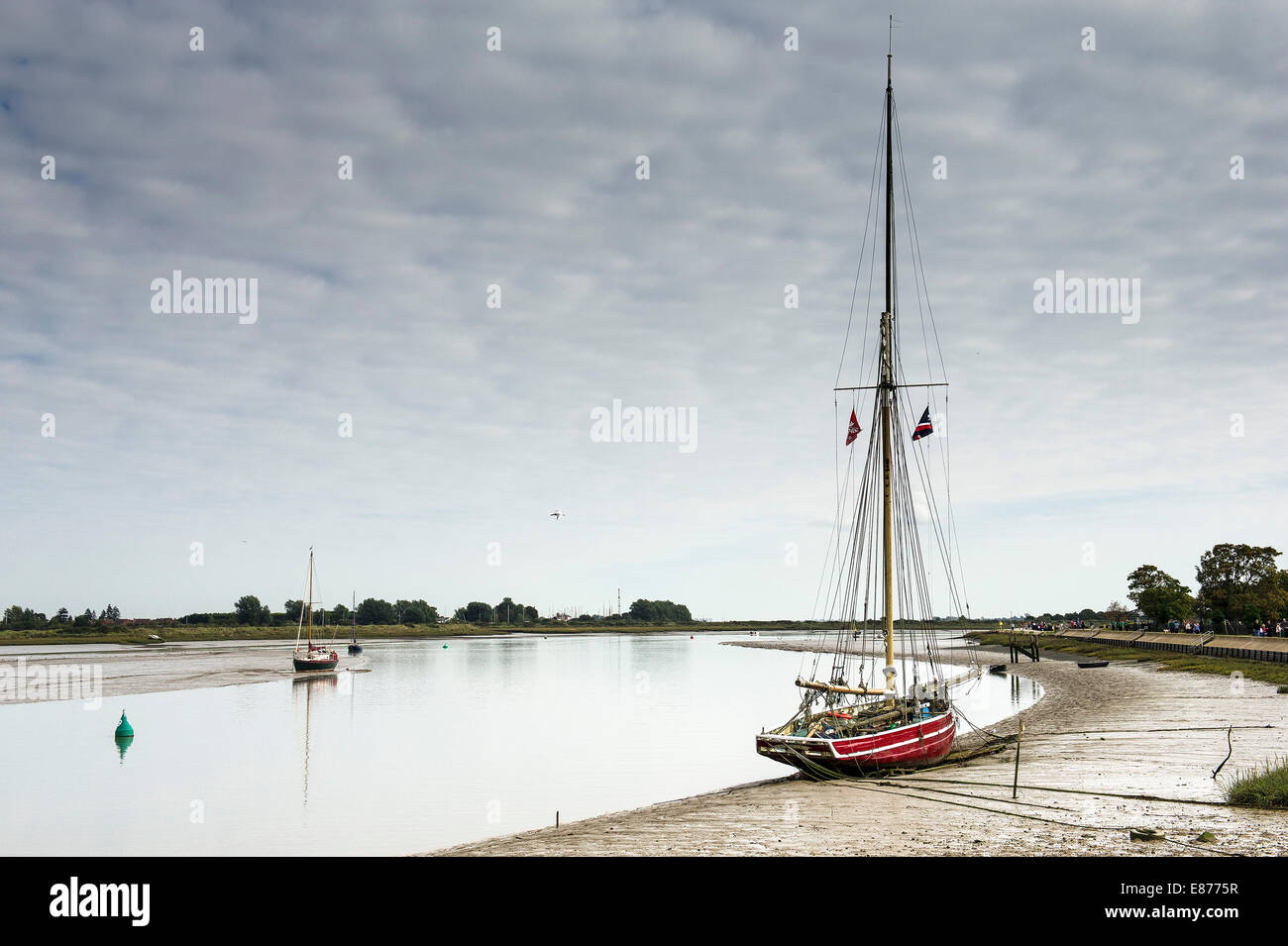 The old wooden fishing smack Telegraph moored on the Blackwater River in Essex. Stock Photo
