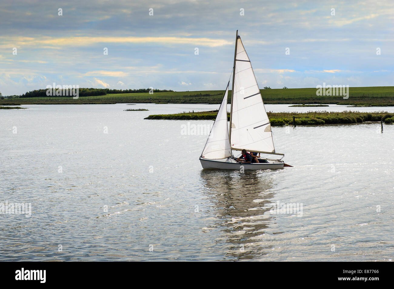 A small sailboat dinghy on the Blackwater River in Essex. Stock Photo