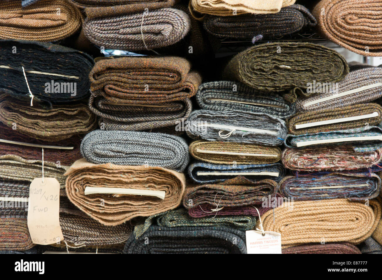 Rolls of Harris Tweed on warehouse shelves. Stock Photo