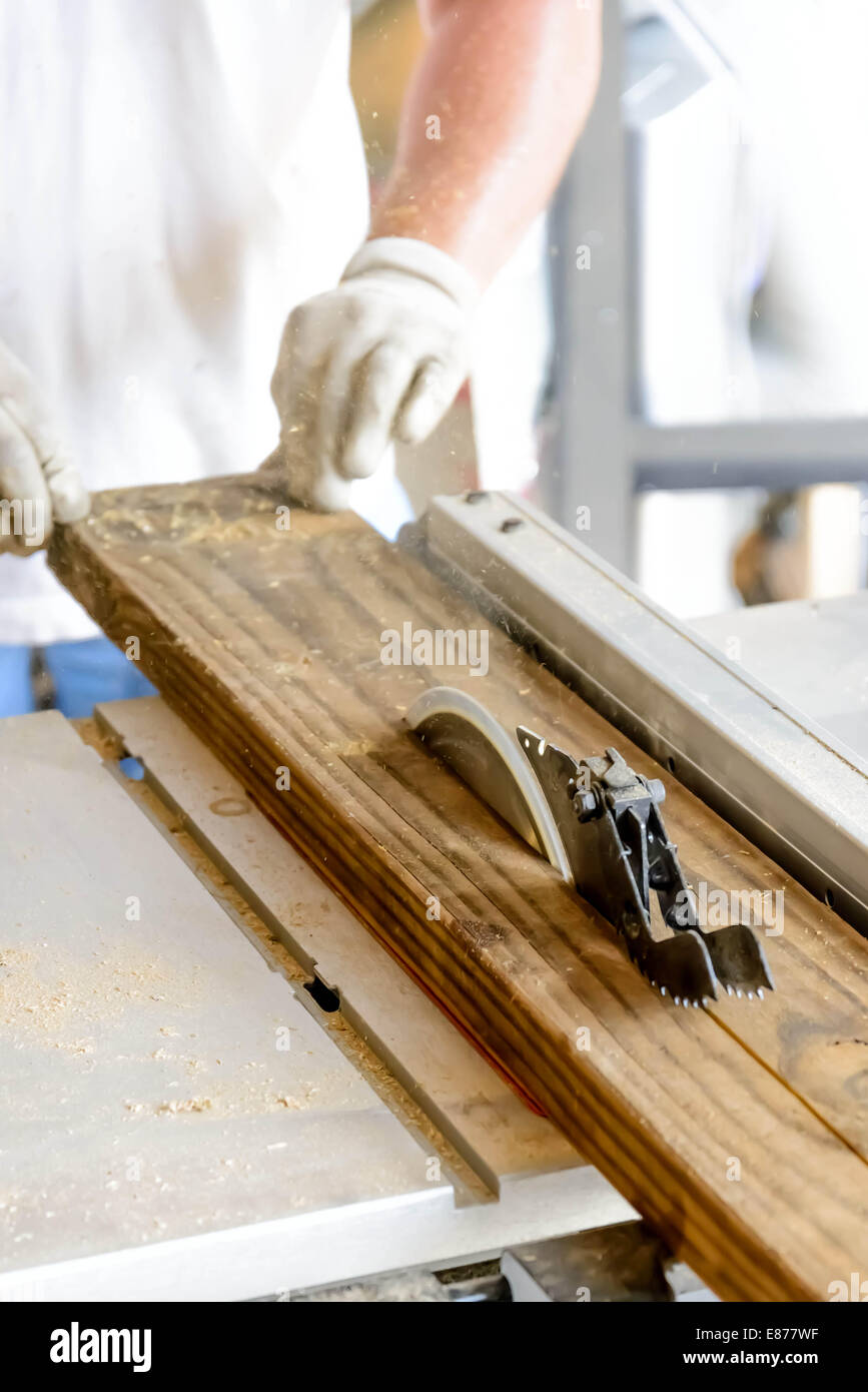 hand and tools doing wood work construction project with table saw Stock Photo