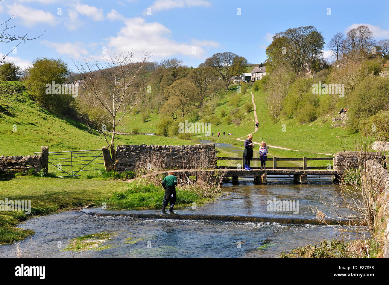 Bradford Dale, near Youlgreave, Derbyshire, Peak District national park, UK. The Mum and daughter are on an old clapper bridge. Stock Photo