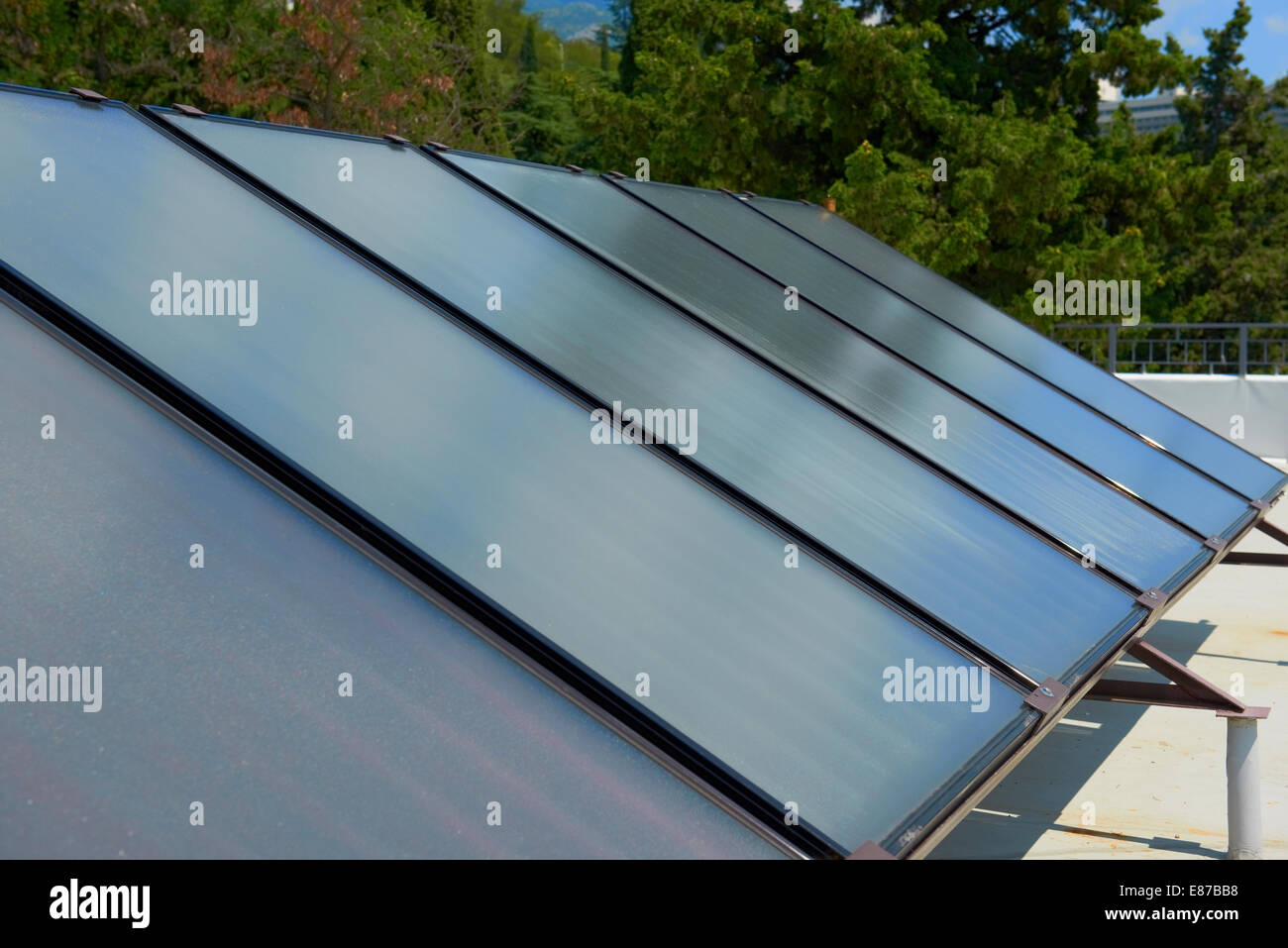 Solar water heating system on the red roof. Gelio panels. Stock Photo