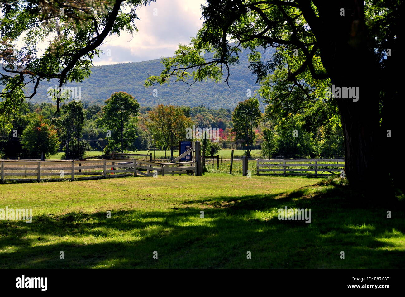 Hancock, Massachusets:  Fences and meadows at the Forest Trail with distant Berkshire Hills at the Hancock Shaker Village Stock Photo